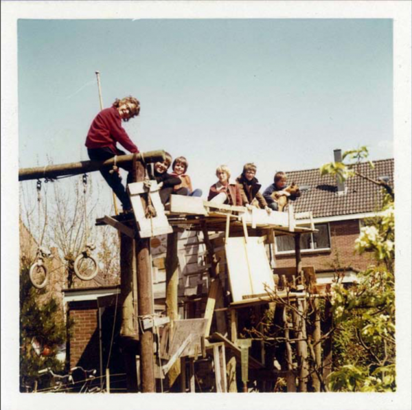 Hut build by Arnout, seated on the right with dog, 1972